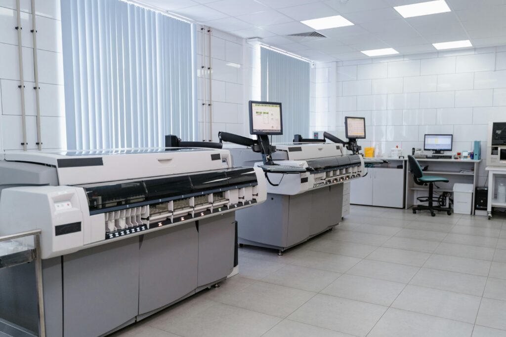 Spacious modern laboratory featuring advanced printing equipment and workstations.